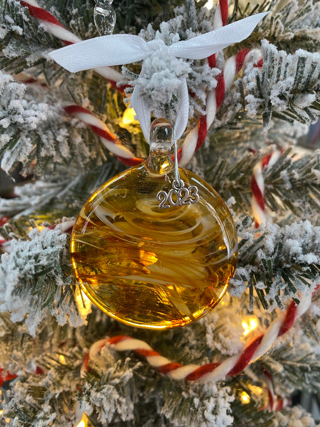 Amber and white round flat glass ornament